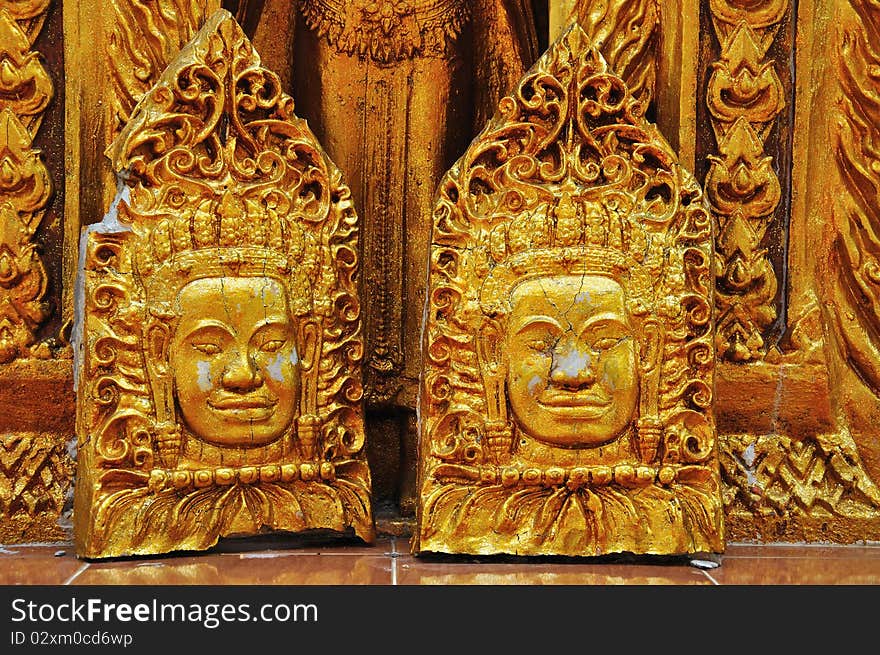 Face Of Golden Statue At The Temple