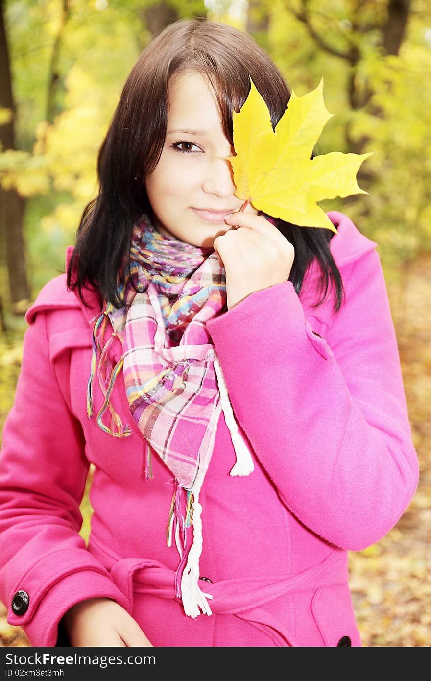 Girl it holds leaf covering the eye. Girl it holds leaf covering the eye