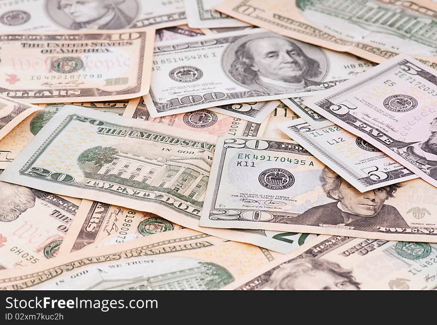 Money background of $5-$100 banknotes