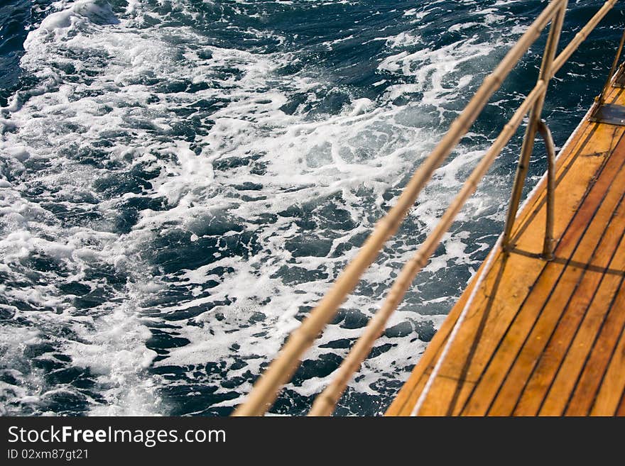 Summer series: modern wooden yacht in the sea. Deck view