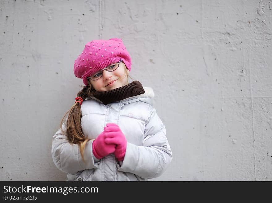 Adorable Small Girl In Bright Pink Hat