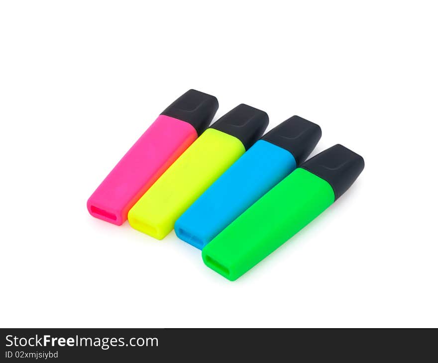 Four colorful highlighters isolated on a white background