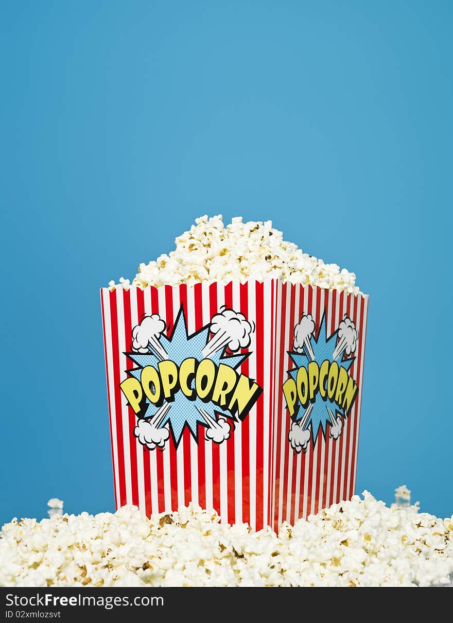 Basket of Popcorn on blue background