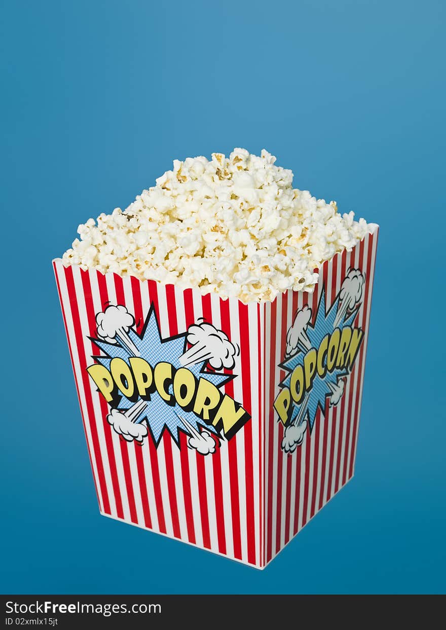 Basket of Popcorn on blue background