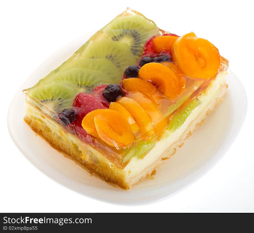 Close-up curd cake with fruits and berries, isolated on white