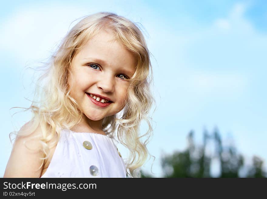 Portrait of laughing little girl outdoor