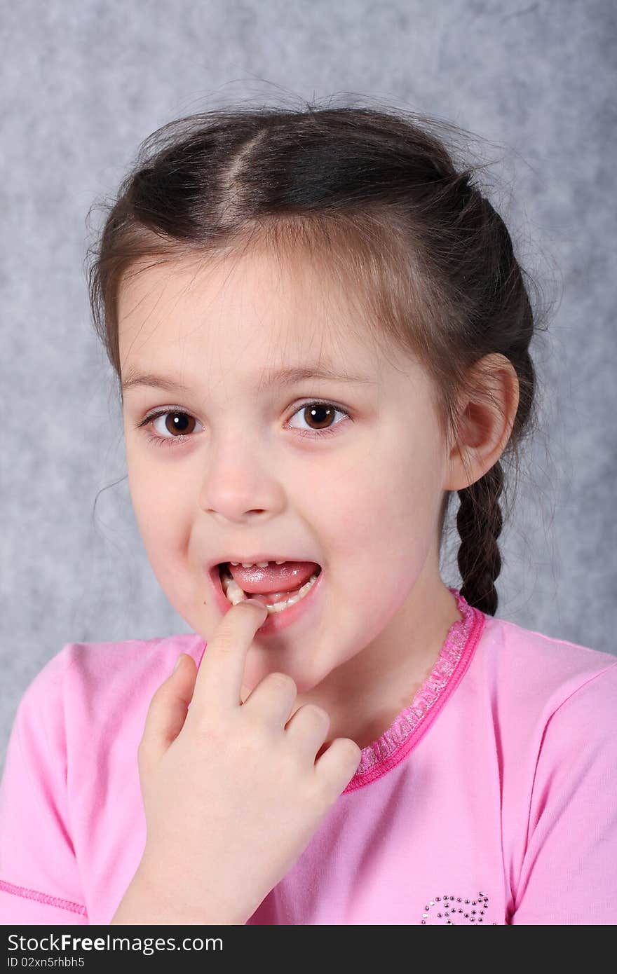 The scared little girl with a finger in a mouth. The scared little girl with a finger in a mouth