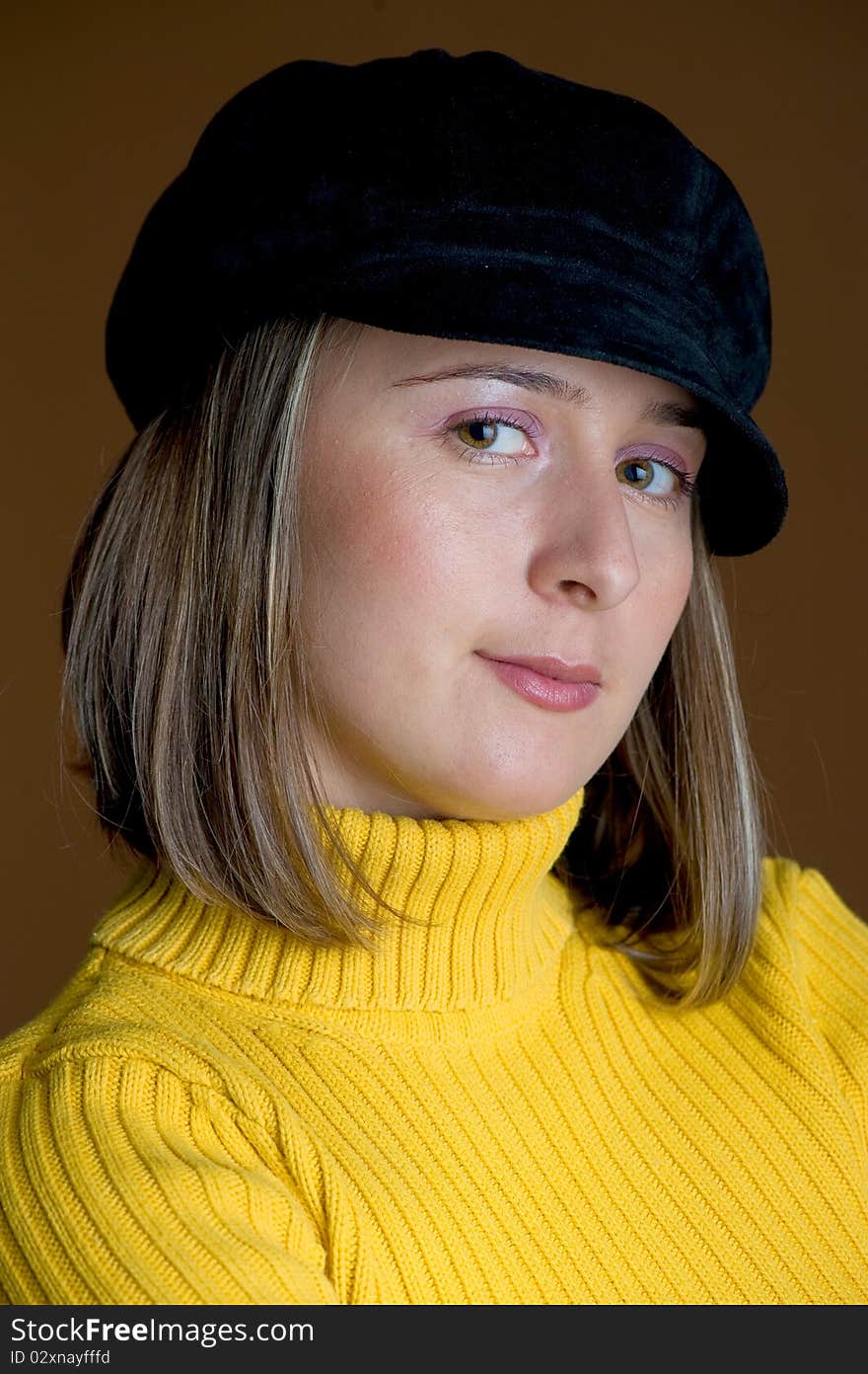 Young and beautiful woman posing in the studio. Young and beautiful woman posing in the studio