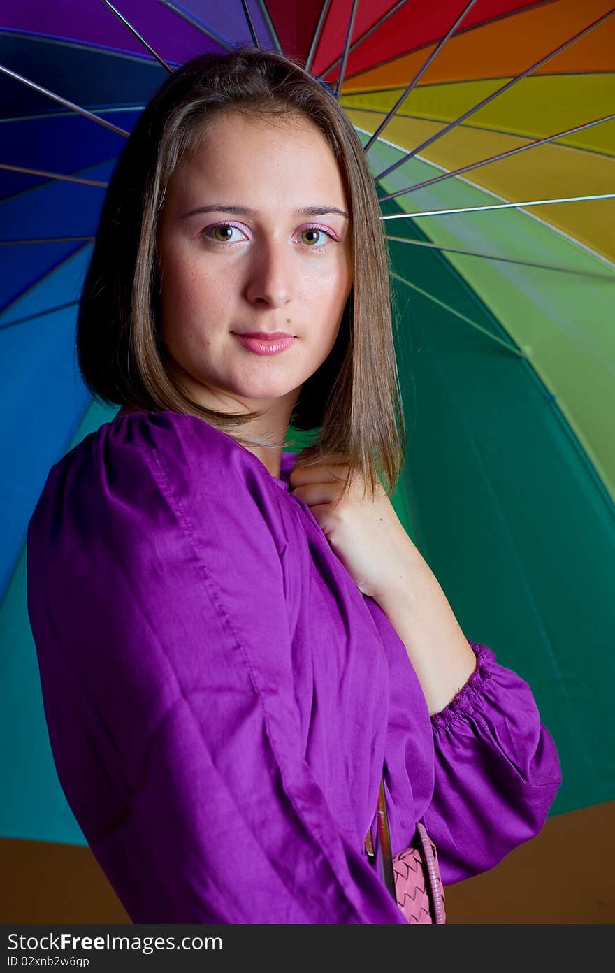 Young and beautiful woman posing in the studio. Young and beautiful woman posing in the studio