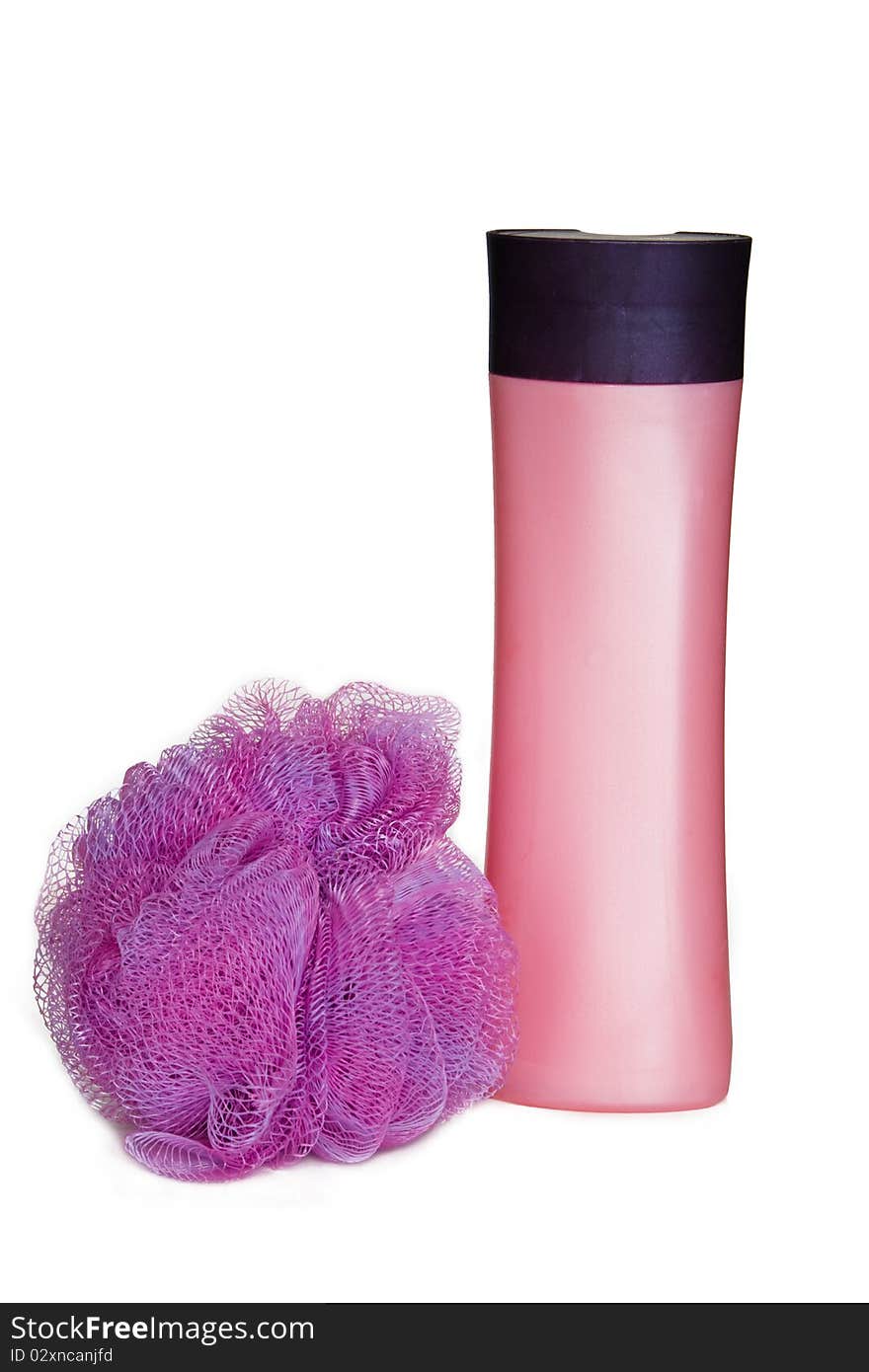 Pink cosmetic bottle and bast whisp isolated on the white. Pink cosmetic bottle and bast whisp isolated on the white