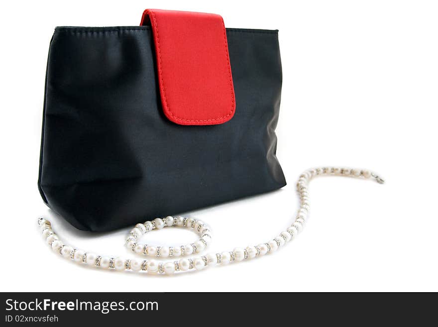 Female bag and beads isolated on a white background