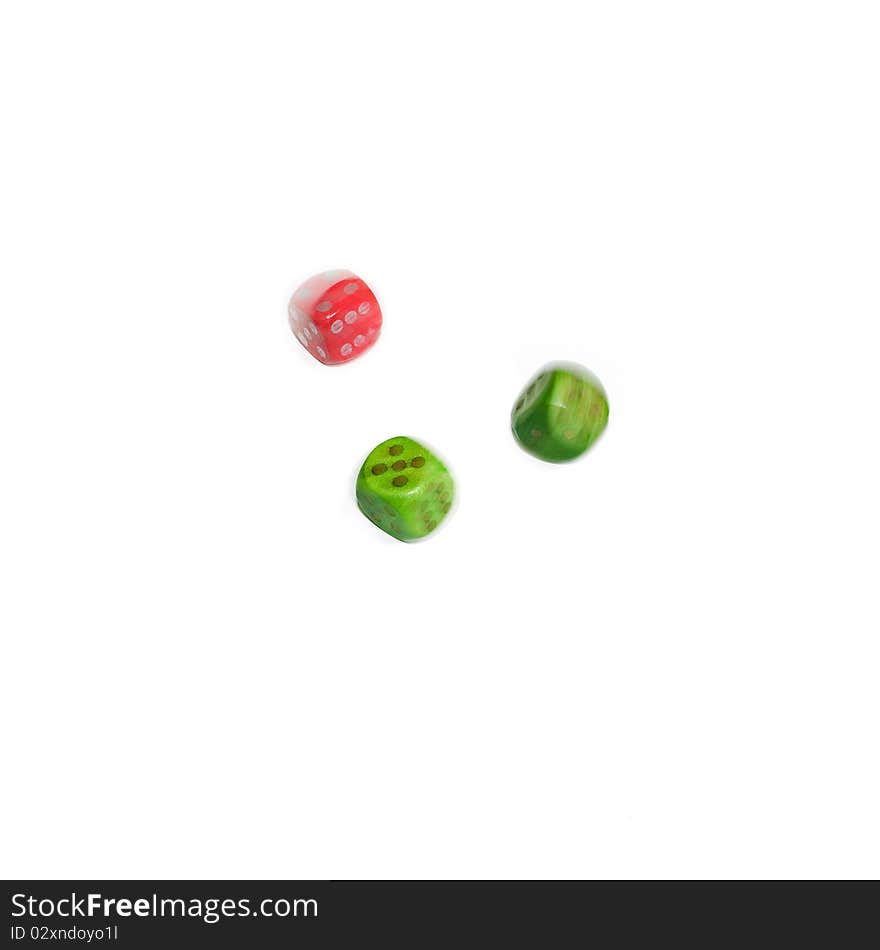 Isolated red and green rolling dice on white background