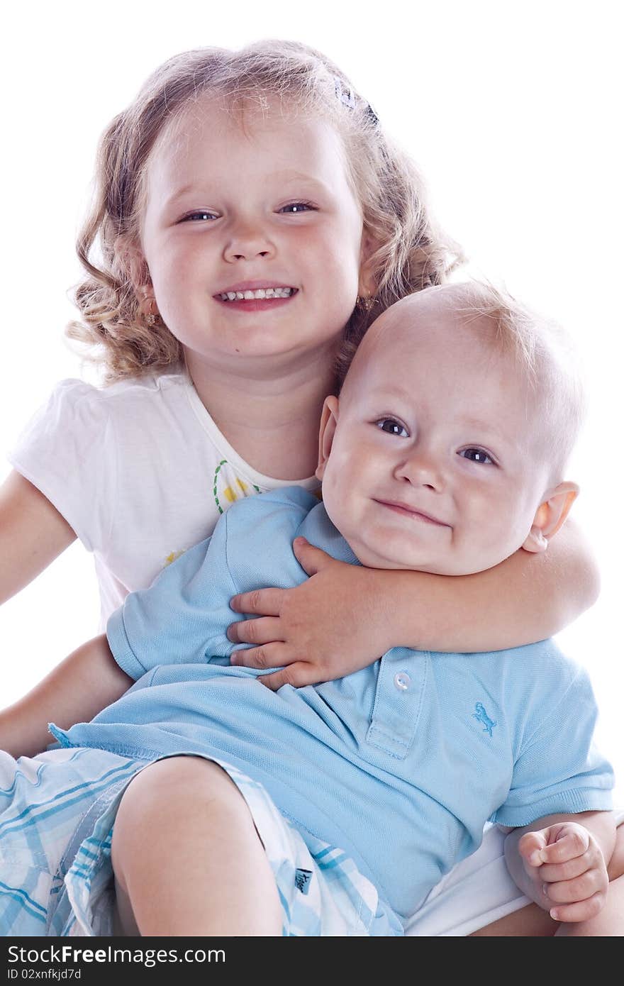 Boy and girl sitting on white background