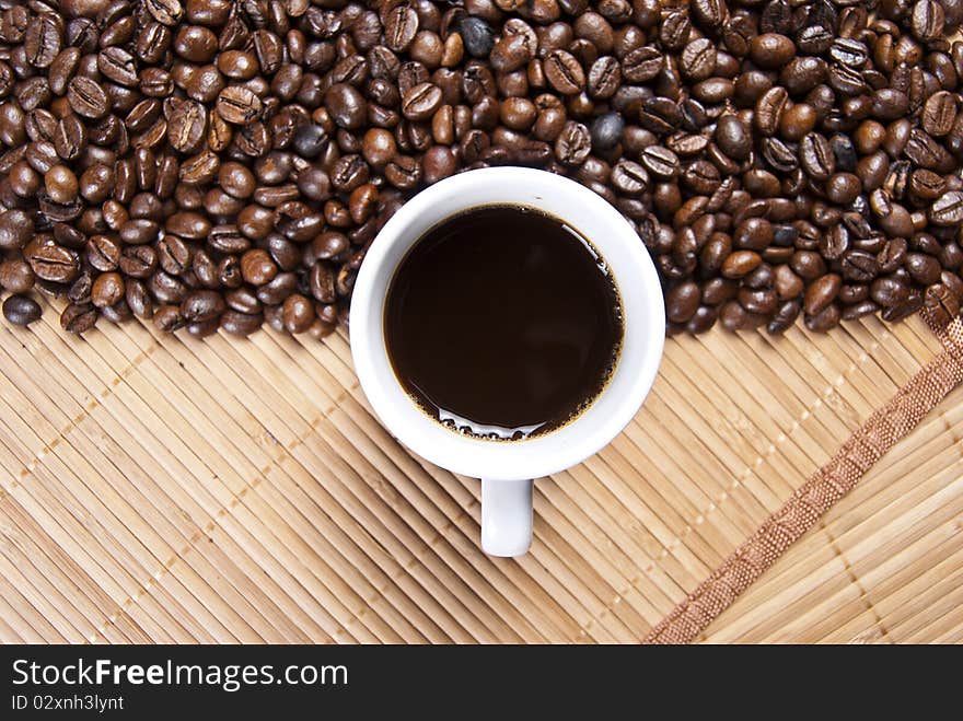 Coffee cup and coffee beans