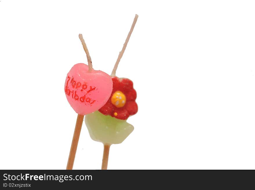 A cute and colorful photography of birthday candles heart shaped flower