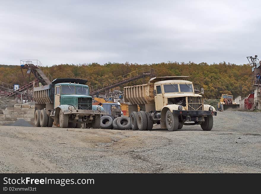 Two old truck in the quarry for the production of gravel in the Crimea