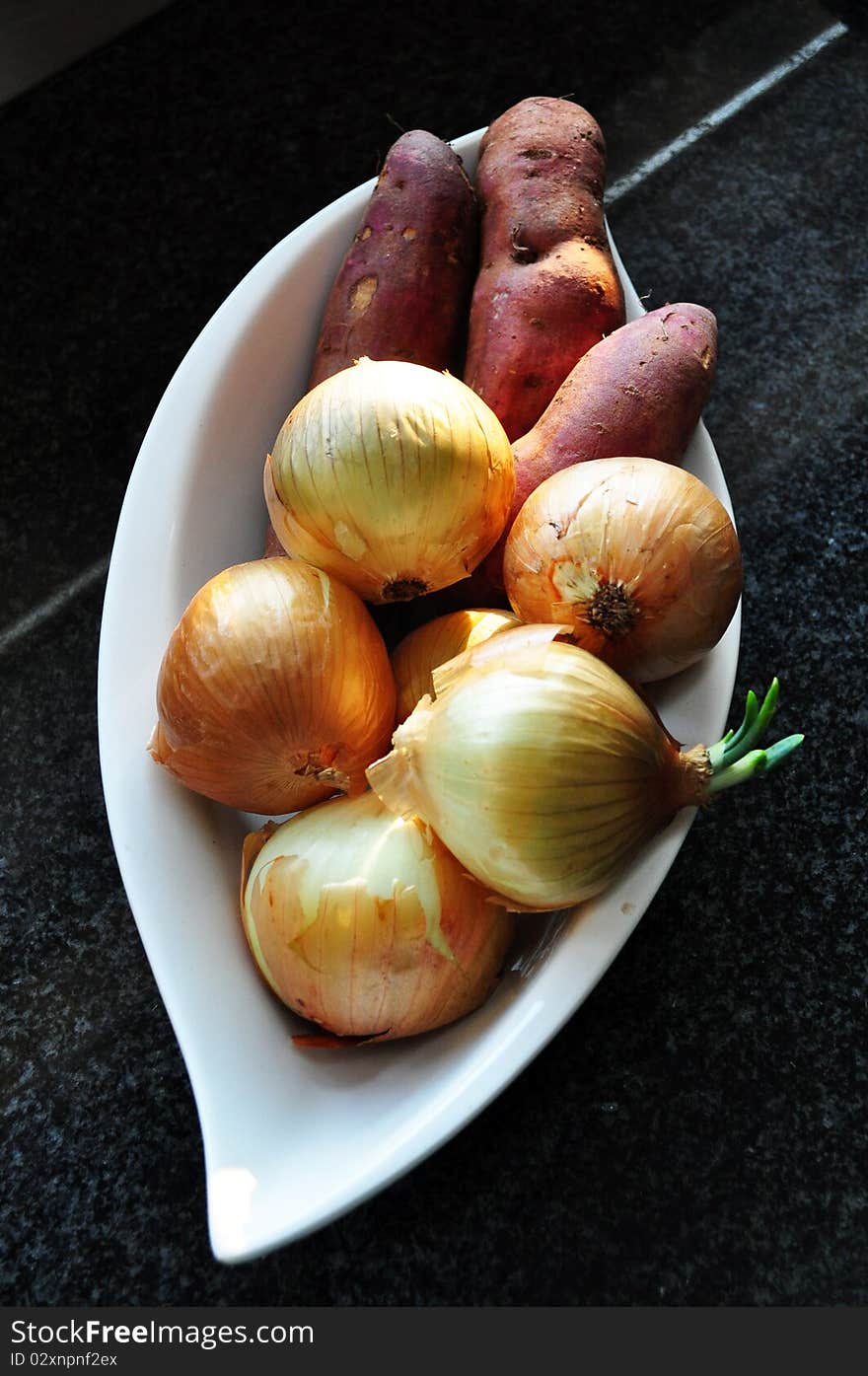 Golden Onions & Sweet Ruby Potatoes in bowl. Golden Onions & Sweet Ruby Potatoes in bowl