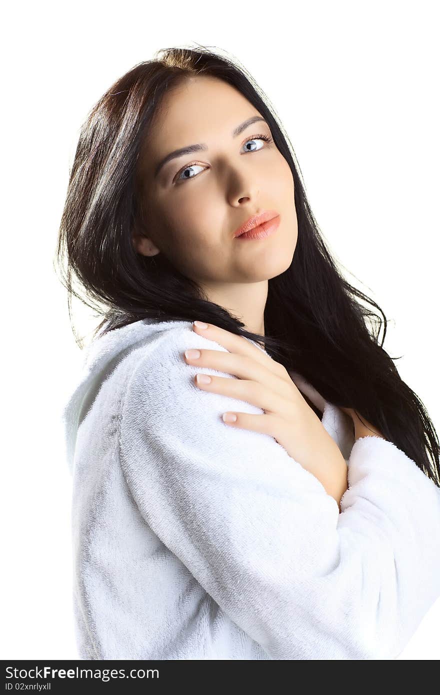 Beautiful woman in bathrobe over white background