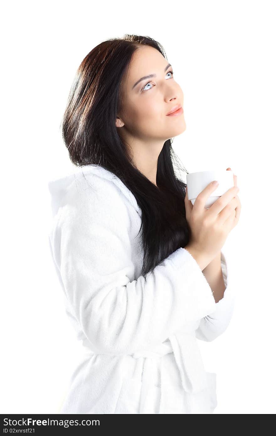 Beautiful woman in bathrobe over white background