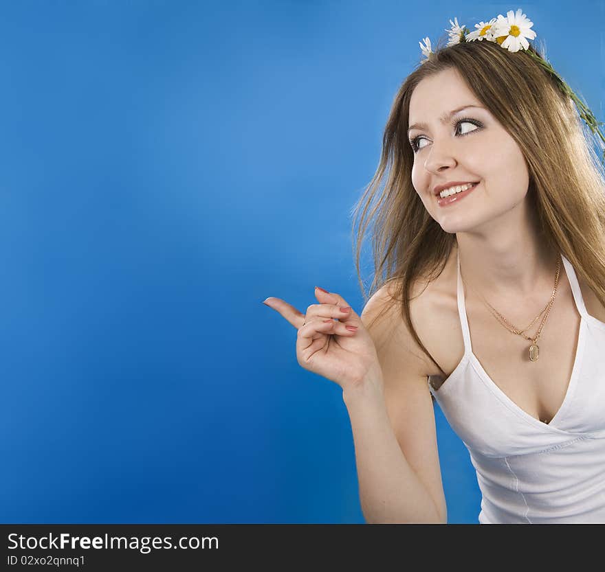 Beautiful woman smiles on a blue background