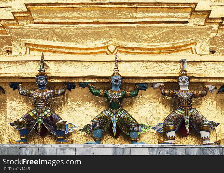 The garuda statues on the base of golden satupa in The Emerald Buddha Temple in Bangkok, Thailand. The garuda statues on the base of golden satupa in The Emerald Buddha Temple in Bangkok, Thailand.