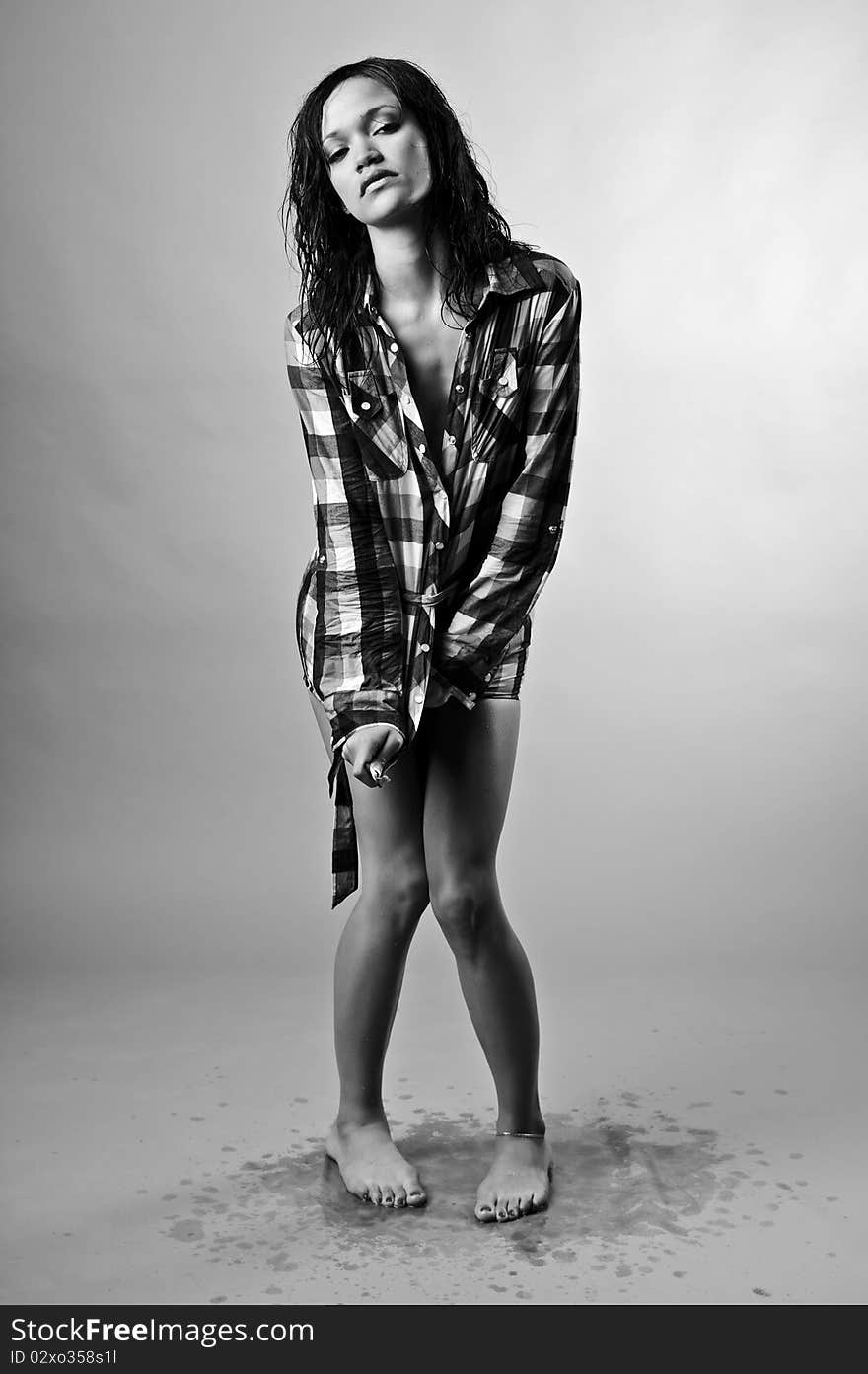 Wet fashion model drips all over the studio floor. Wet fashion model drips all over the studio floor