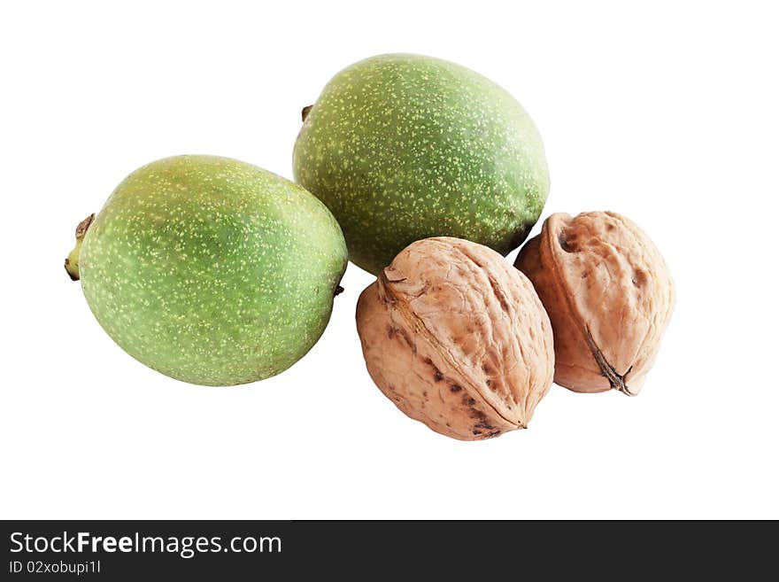 The walnuts in the green rind on the white