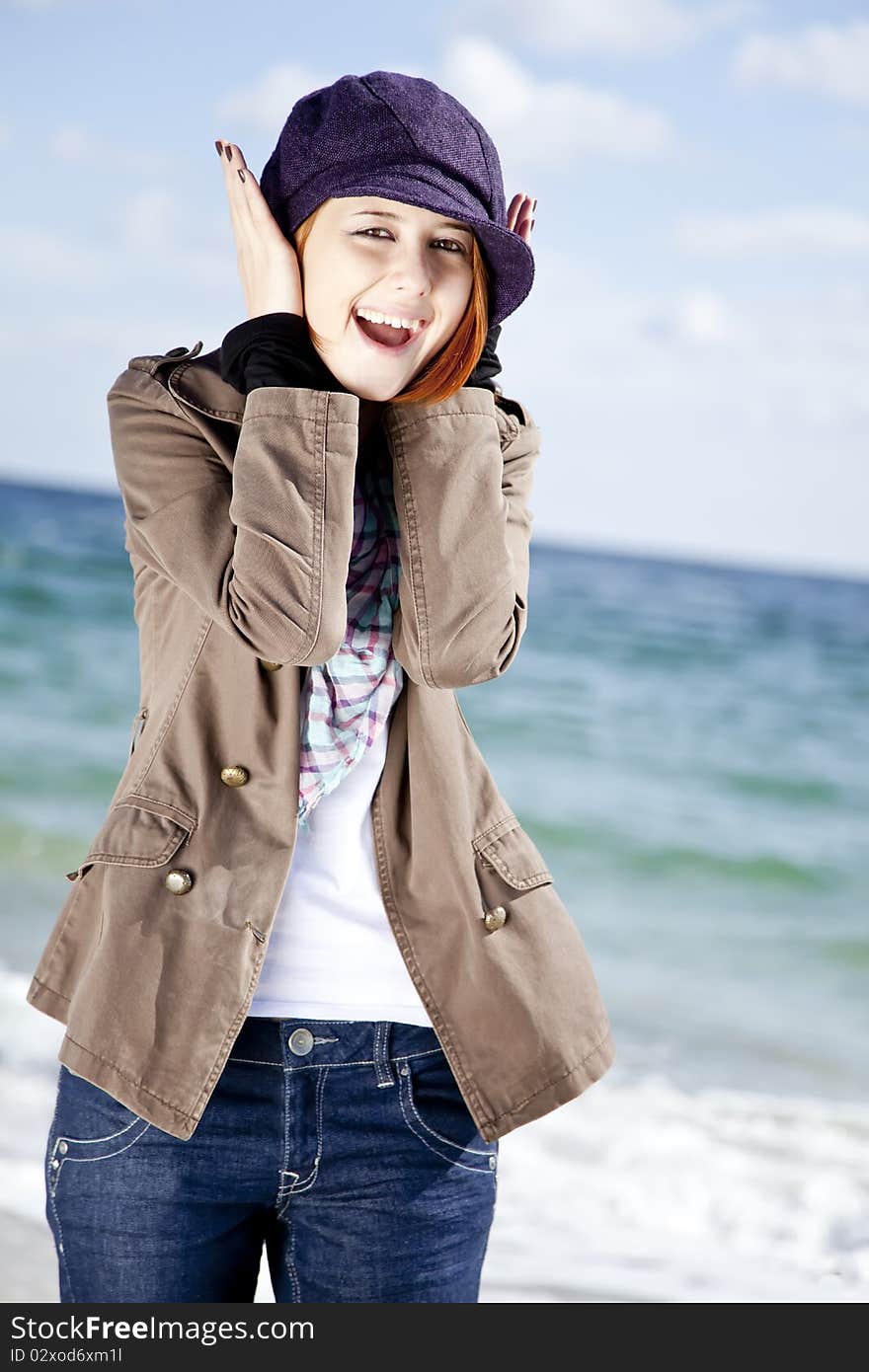 Fashion young women at the beach in sunny day. Outdoor photo.