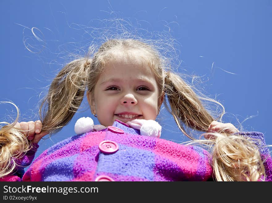 Photo of young girl at high position. Outdoor photo.