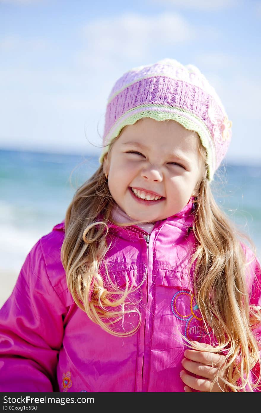 Portrait of cute young girl on the beach