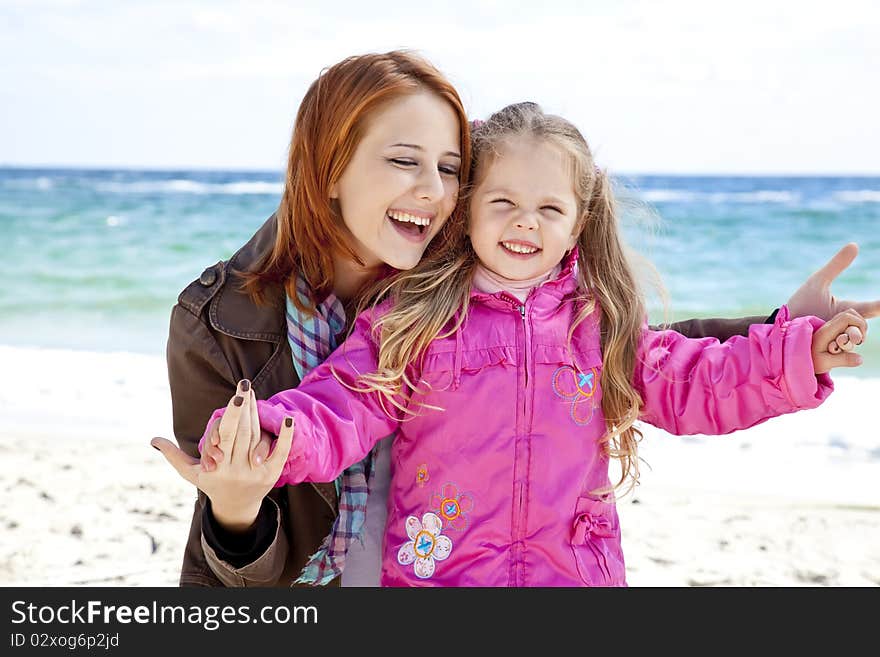 Two sisters 4 and 21 years old at the beach