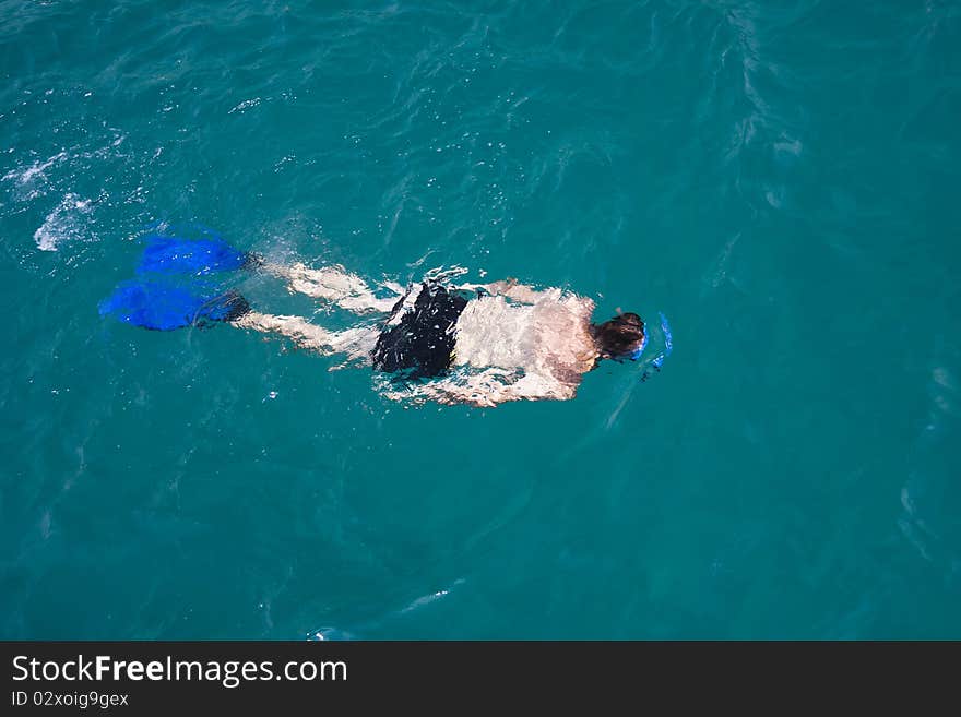 A man snorkeling in the sea in Greece