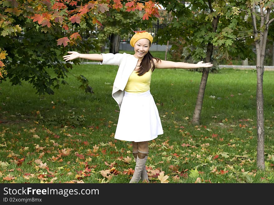 Joyful girl in autumn park