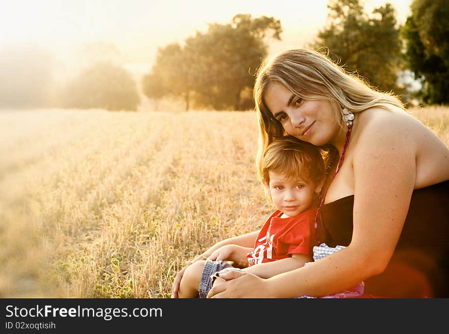 Mother and son at a crop field