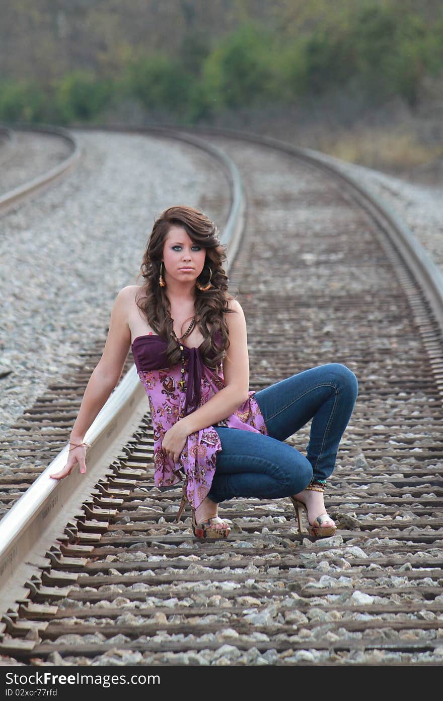 Lovely young lady on the railroad track. Lovely young lady on the railroad track.