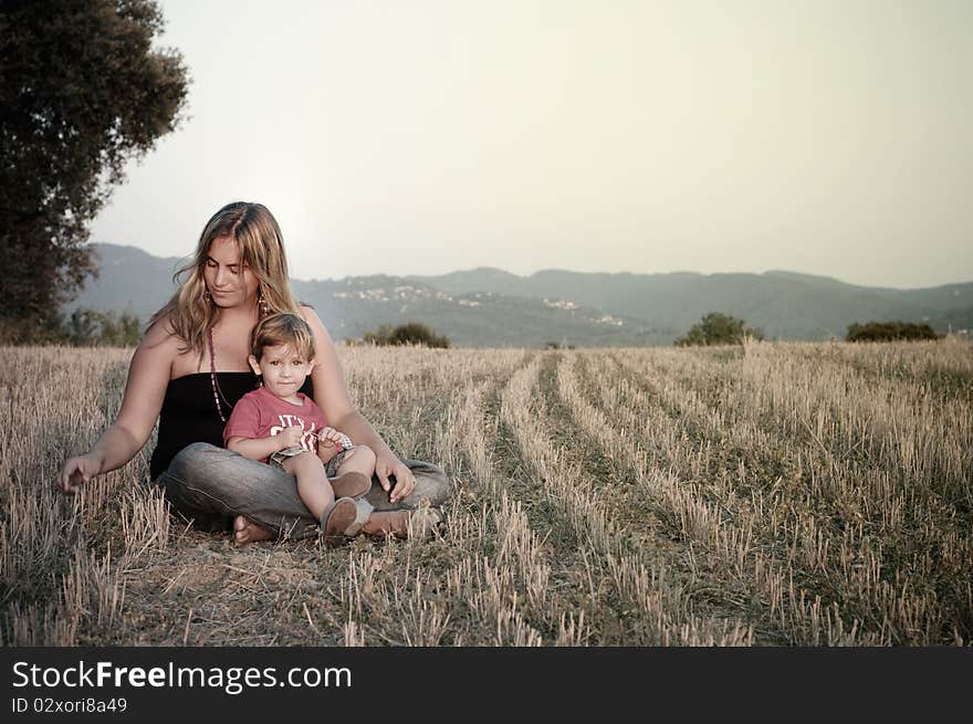 Mother and son at a crop field