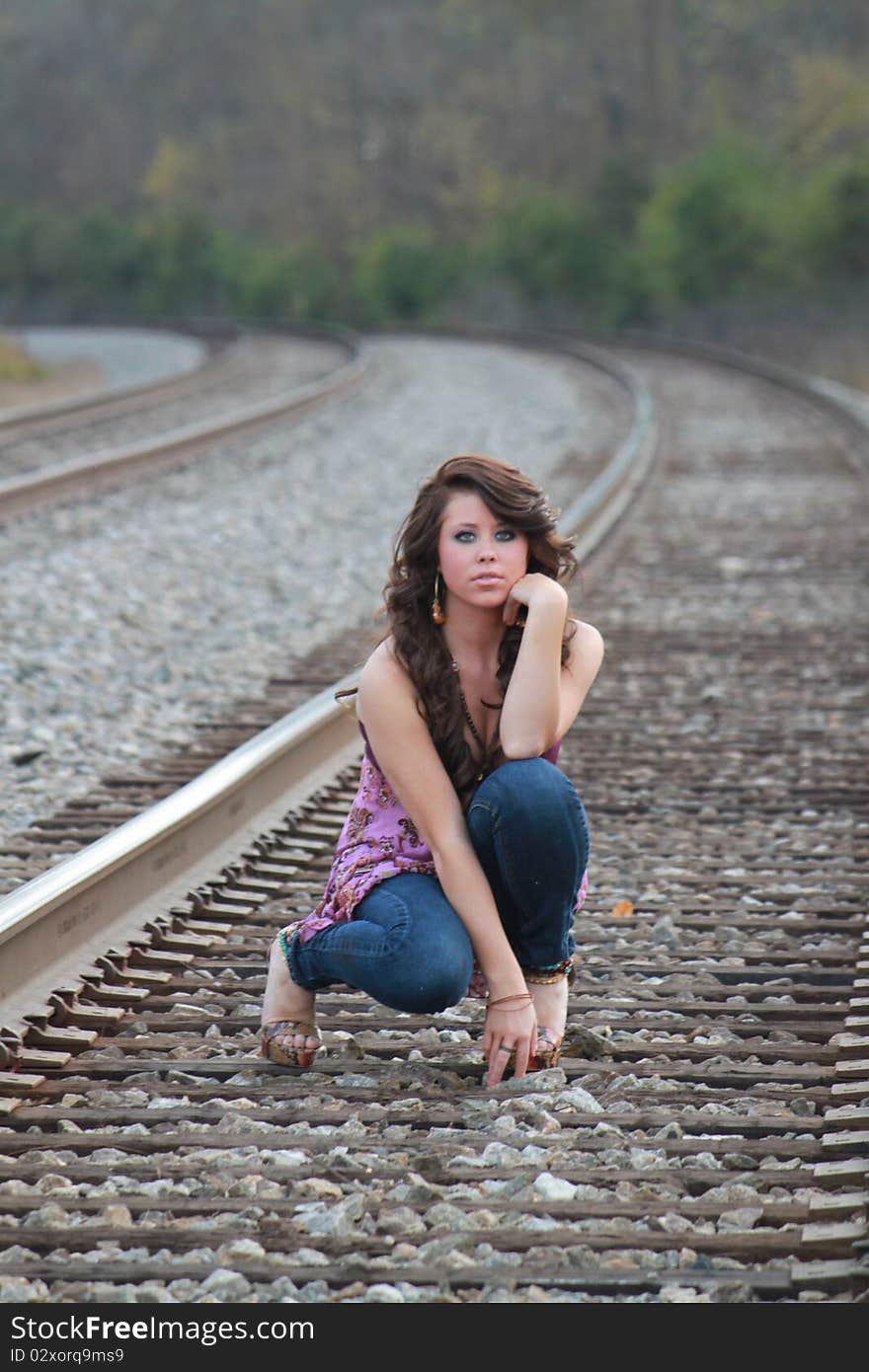 Lovely young lady on the railroad track. Lovely young lady on the railroad track.