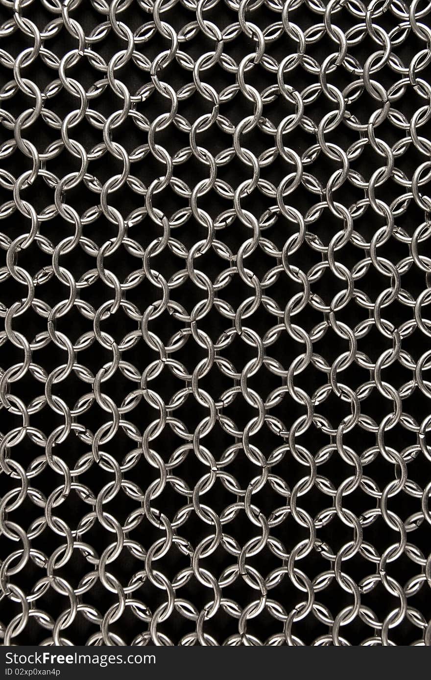 Detail of a chainmail on black