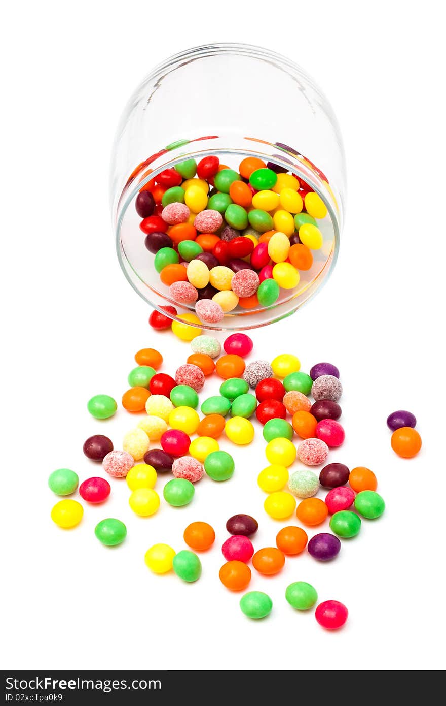 Candy in a glass jar on white background