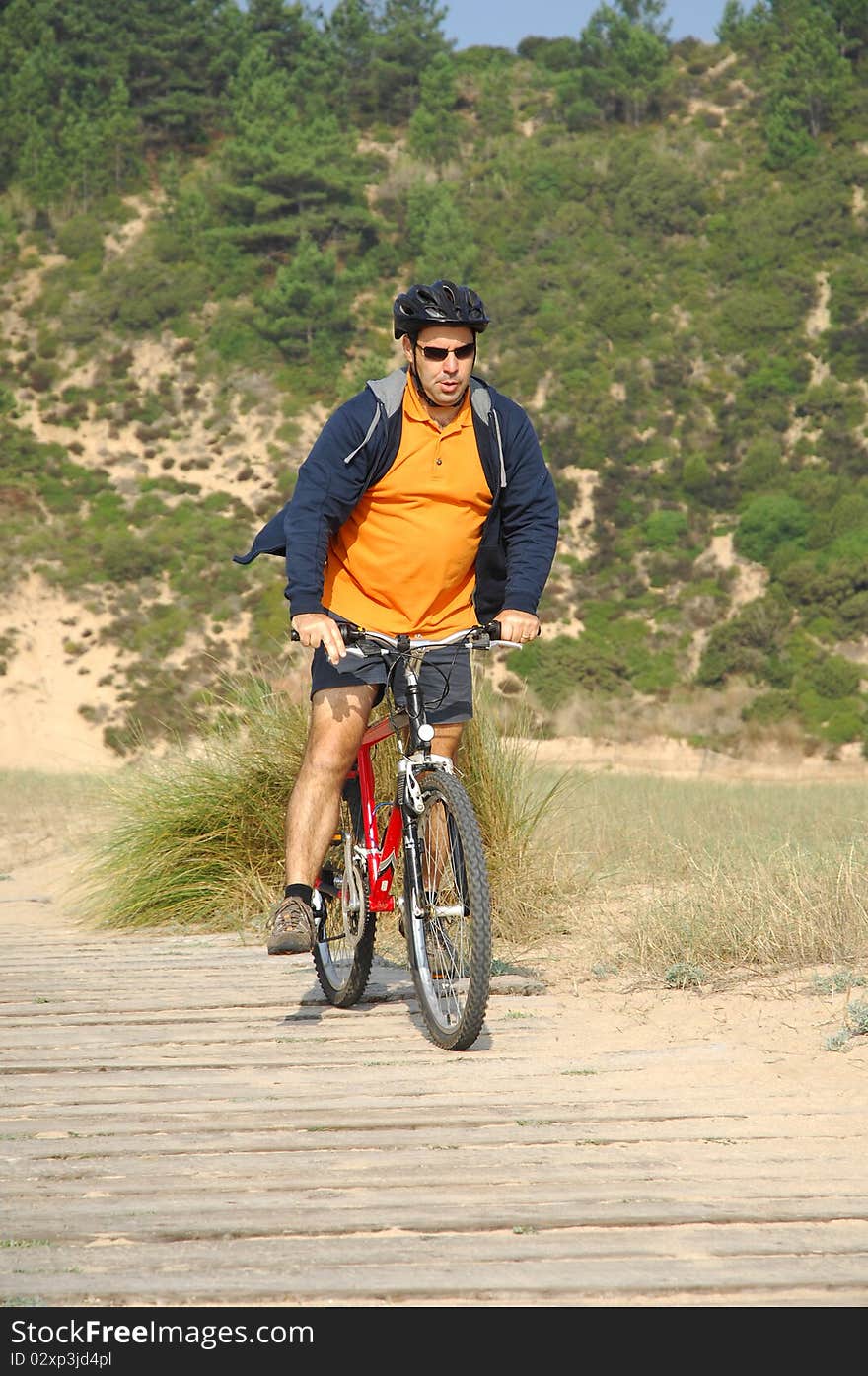 Biker in action with a beautiful landscape