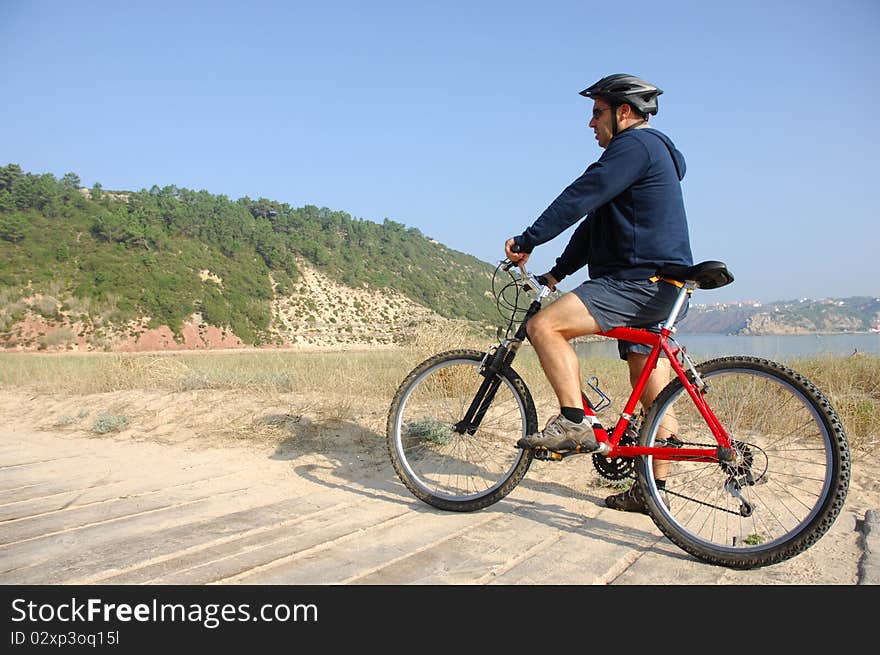 Biker in action with a beautiful landscape