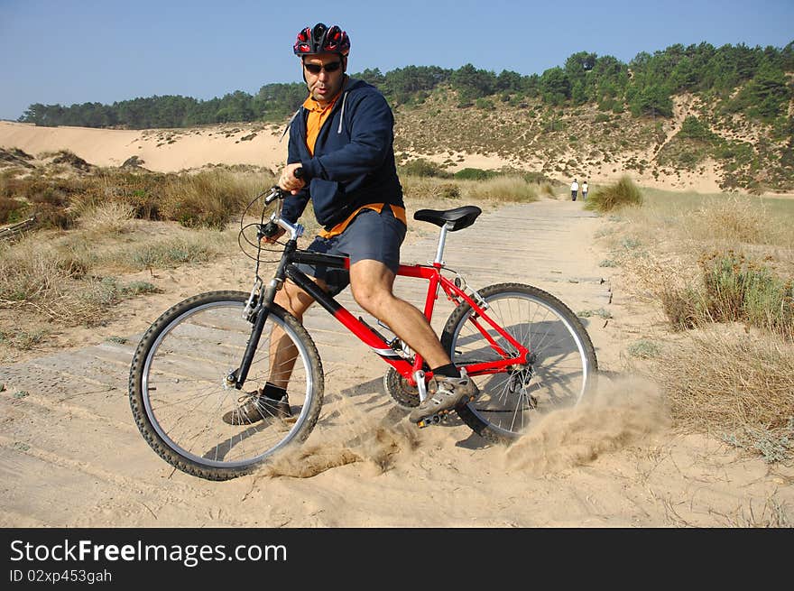 Biker in action with a beautiful landscape