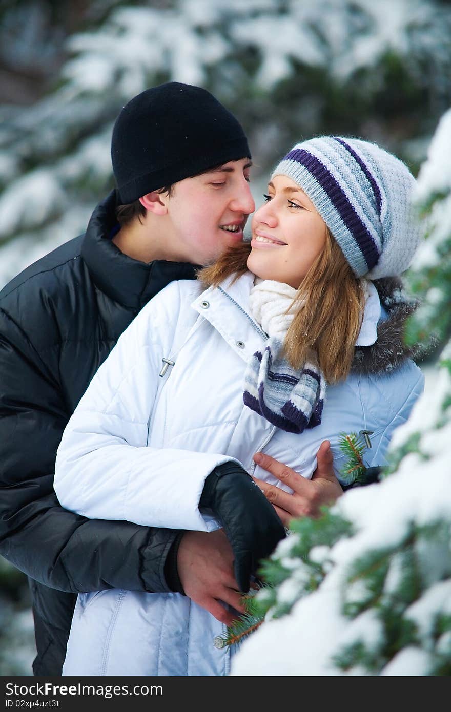 Beautiful couple in winter park.