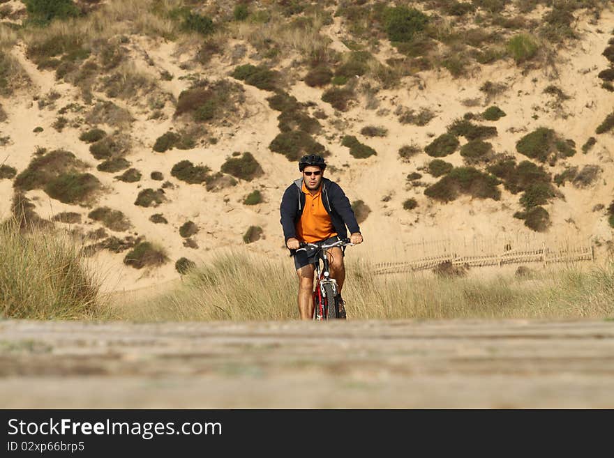 Biker in action with a beautiful landscape