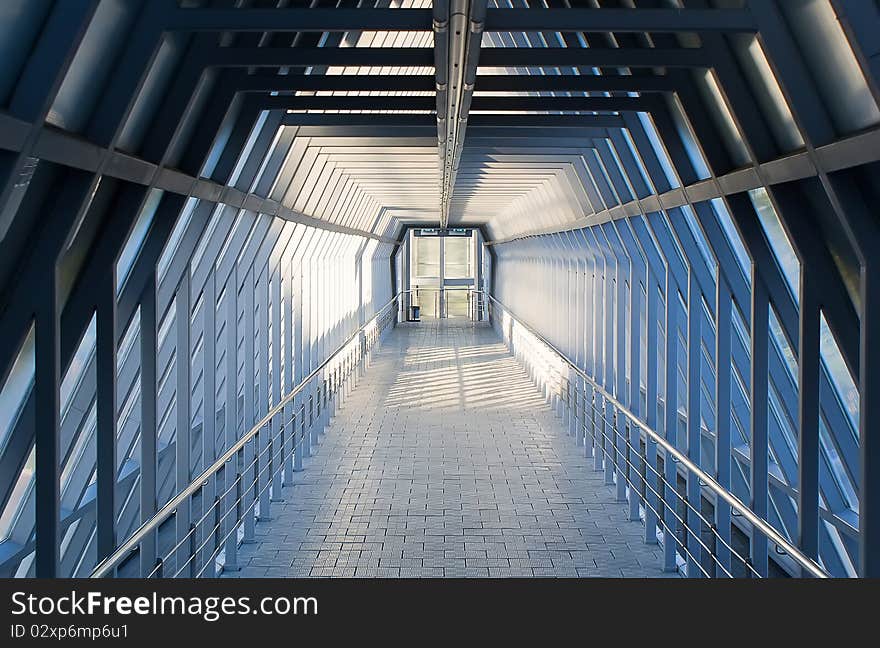 Pedestrian crossing over road filled in with a sunlight. Pedestrian crossing over road filled in with a sunlight