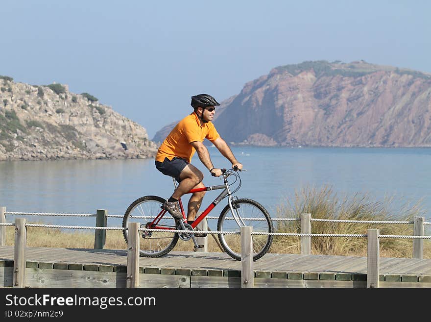 Biker in action with a beautiful landscape