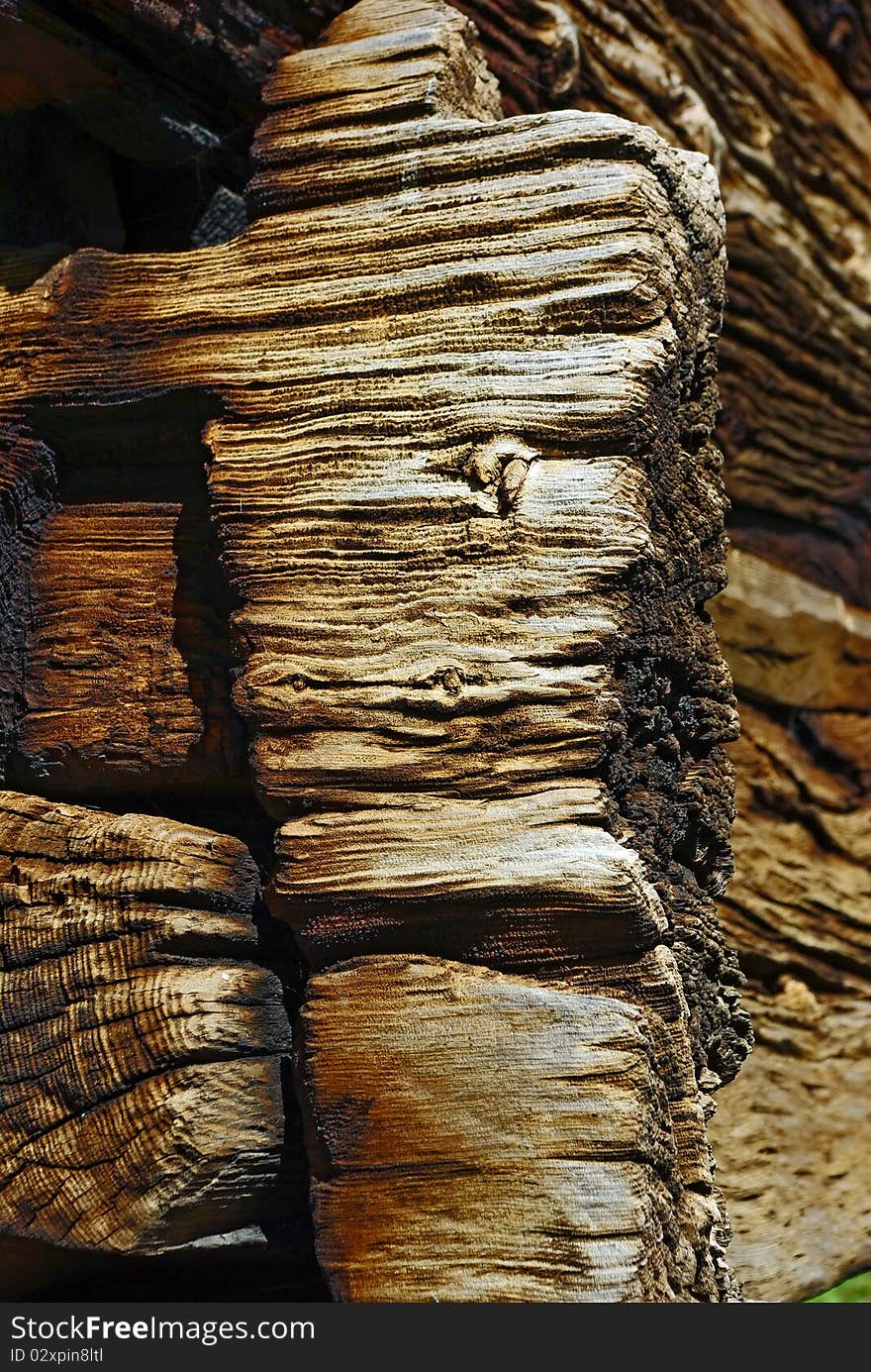 Close-up image of corner of ancient wooden house