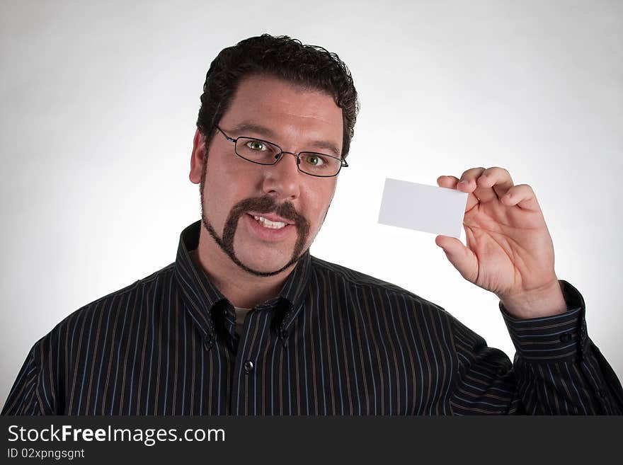 Casual man holding blank business card