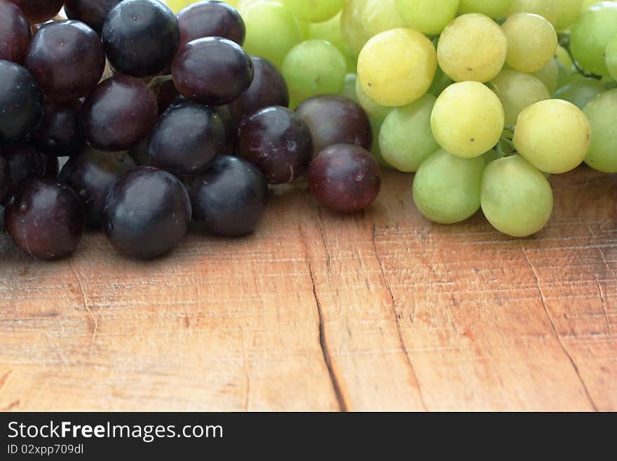 Green & Black Grapes on outdoor table. Green & Black Grapes on outdoor table