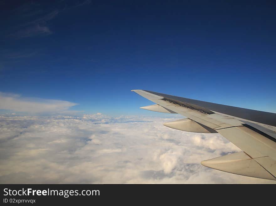 Aerial view on clouds and blue sky from airplane. Aerial view on clouds and blue sky from airplane.